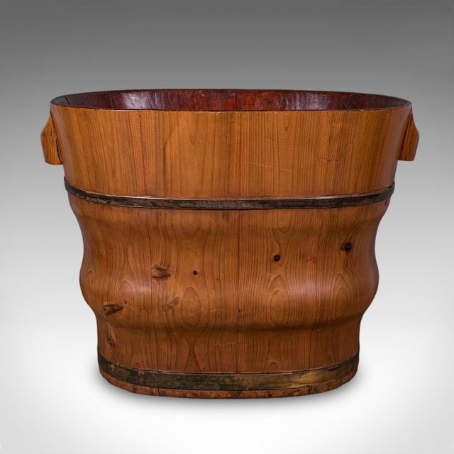 This is an antique waste paper basket. A Dutch, cedar and brass-bound bathroom or home office bin, dating to the late...