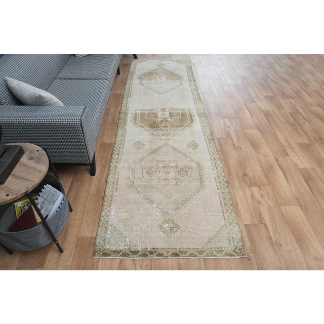 This vintage hand-knotted area rug is a semi-antique vintage area rug. The '70s Eastern region of Anatolian's unique rug...