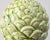 A sculptural ceramic artichoke finial in a pale celadon glaze with subtle crackle and speckled surface. The classical...