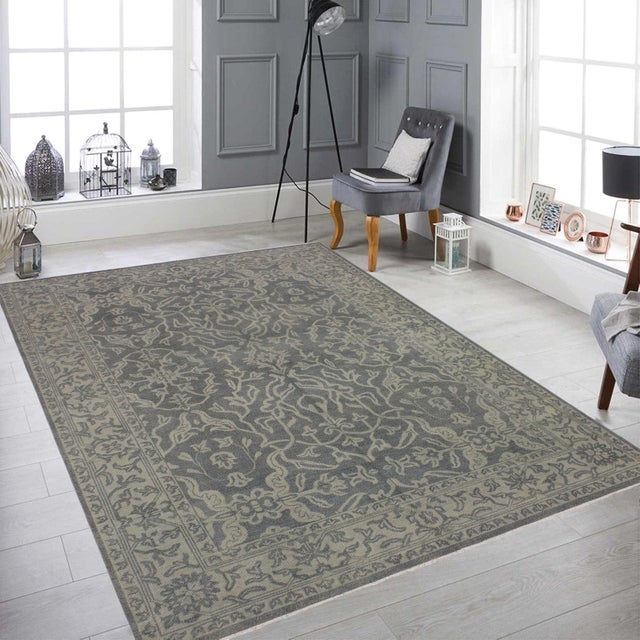 Elevate your space with this hand‑knotted traditional area rug, crafted with meticulous detail and a timeless gray, beige...