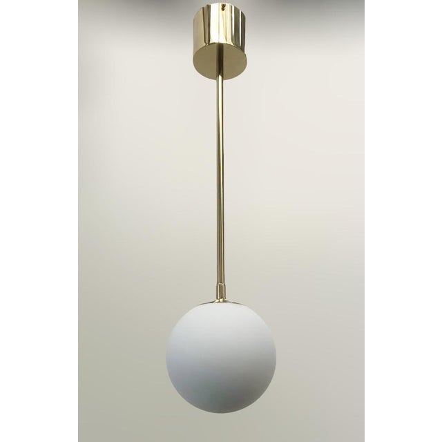 Italian Uno Polished Brass Matte White Globe Pendant by Fabio LTD For Sale - Image 3 of 6