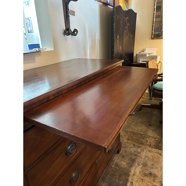 Handsome large scale Antique, English chest handcrafted in mahogany with five drawers retaining the original brass...