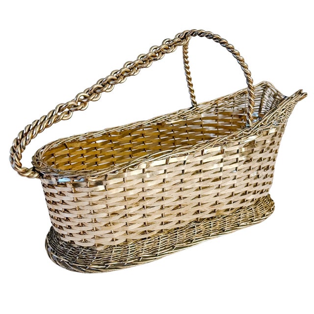 An elegant vintage silver-plated sommelier-style wine bottle cradle crafted in a woven basketweave wire pattern. Features...
