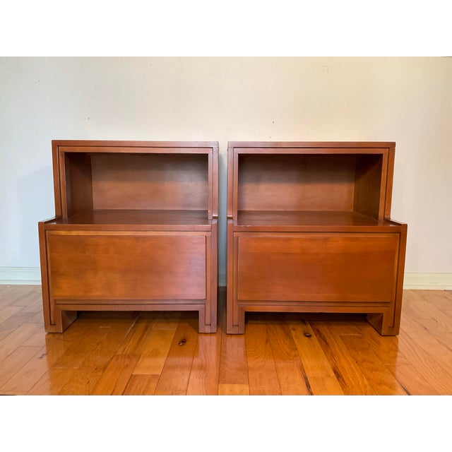 Pair of 1950’s vintage Mid-Century Modern nightstands by designer Russell Wright for Conant Ball. These nightstands...