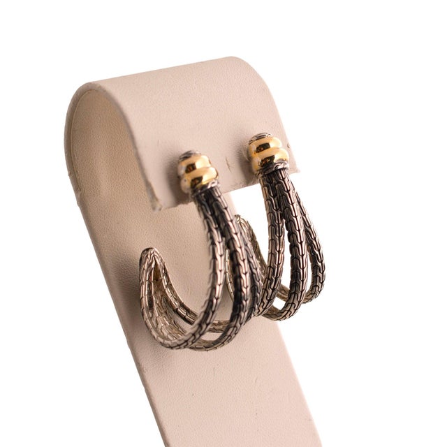 A pair of vintage sterling silver and 18k gold half hoop textured earrings by John Hardy. These are a cool unique shape....