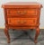 A beautiful vintage French Louis-style bedside table , featuring classic cabriole legs, elegant brass handles, and smooth...