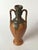 A ceramic amphora-form liqueur vessel produced by Denbac, France, in the 1950s for the iconic French spirits brand...