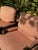 A charming pair of custom ladder back lounge chairs by Walter E. Smithe, featuring solid wood frames and classic red...