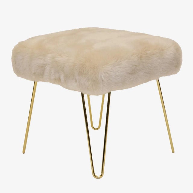 The perfect addition to any space! Wonderfully proportioned pair of ottomans upholstered in cream colored faux fur. These...