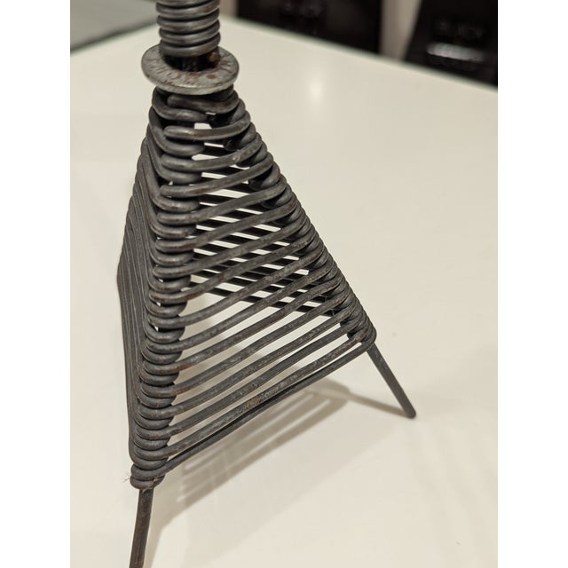 Contemporary forged steel candlestick by British blacksmith Karl Howard. Architectural tripod form with tension-wrapped...