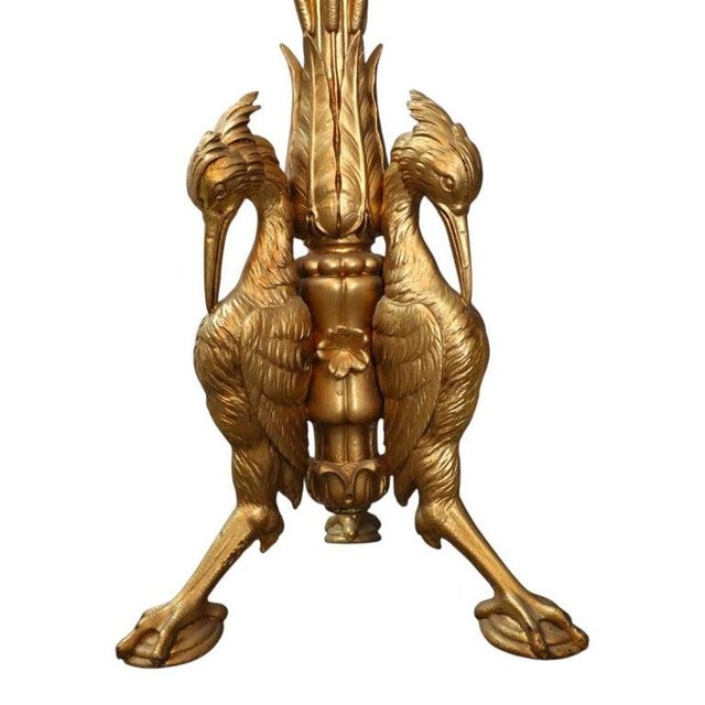 An exquisite Aesthetic Movement sculpture stand, dating to approximately 1880. This piece features a circular dark green...
