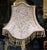 A striking statement piece for a refined interior, this French-style floor lamp features an intricately ornamented gilded...