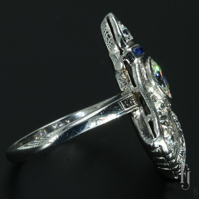 This is a Vintage 14k White Gold Art Deco Style Ring featuring One 0.5ct. F/SI2 Round White Diamond Center & ~0.24ctw of...