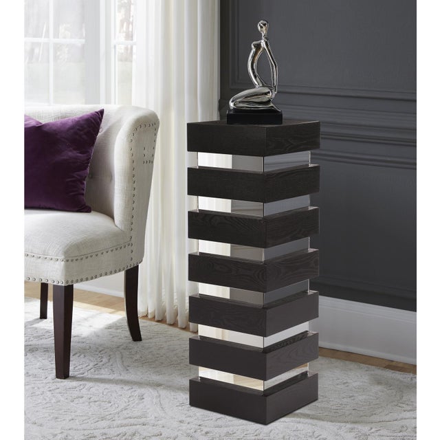 This pedestal features a tall rectangular body fashioned from alternating stacked wood and mirrored levels. Each wood...