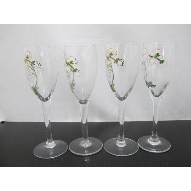 Vintage Perrier-Jouet Belle Epoque champagne flutes feature a hand-painted floral design inspired by Emile Gallé's iconic...