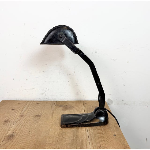 Vintage bankers bauhaus table lamp made in Germany during the 1930s. It features a black metal iron shade with white...