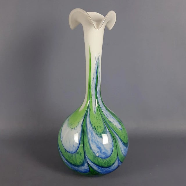 A stunning Murano blown glass vase from Italian modernism, a piece of art with an elegant and modern design. The spirals...