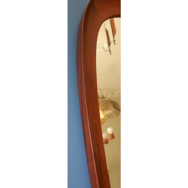 Large AB Glas & Trae Hovmantorp mid century Swedish sculptural mahogany wall mirror dating from about 1960 with beautiful...