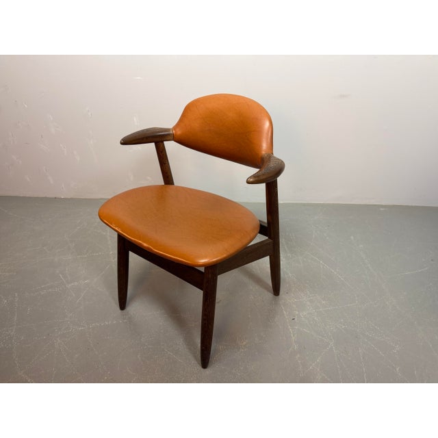 Iconic Cowhorn chair designed by Tijsseling for Hulmefa as part of the Propos series. This celebrated Dutch Mid-Century...