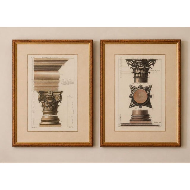 A sophisticated pair of framed architectural engravings depicting classical Roman column capitals and structural details...