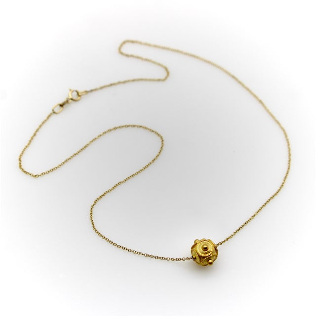 This is a 21k gold Etruscan Revival bead strung on a 14k gold chain. The bead is handmade, circa the 1880s. It has...