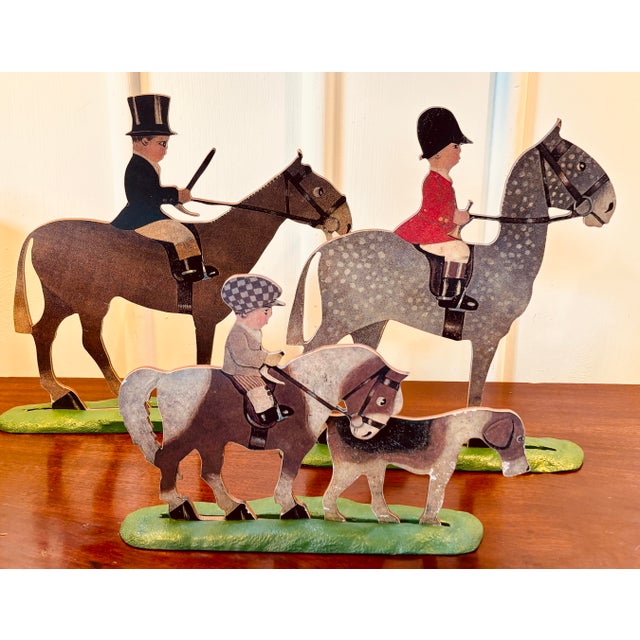 A wonderfully rare and characterful set of English equestrian folk art figures, circa 1930s, depicting three mounted...