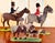 A wonderfully rare and characterful set of English equestrian folk art figures, circa 1930s, depicting three mounted...