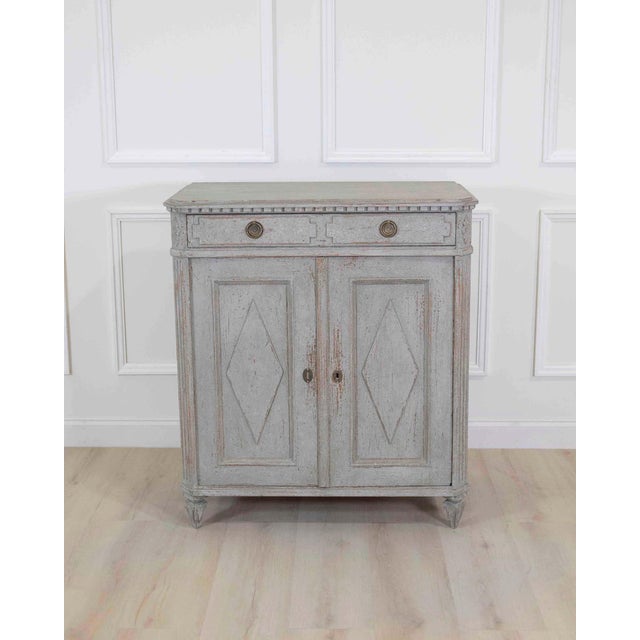 Made in Sweden in the late nineteenth century, this sideboard belongs to the Scandinavian tradition of practical case...