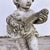 Graniglia statue, putto Height: 58 Width: 26 Depth: 16 This piece is attributed to the mentioned designer/maker. It has no...
