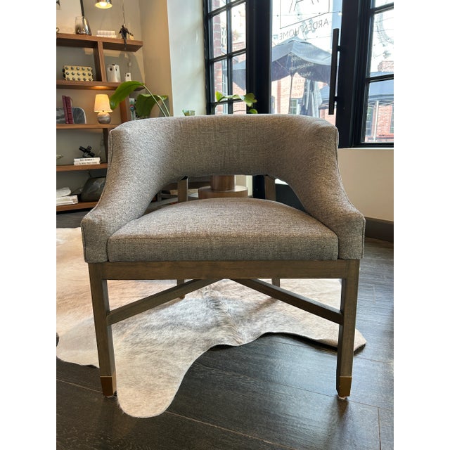 Large dining chair in grey woven fabric with distressed birch legs and brass caps. Unknown maker, curated by Arden Home....
