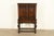 An exceptional antique English Jacobean or Tudor style bookcase or bar cabinet By Berkey & Gay USA, Circa 1920s Carved...