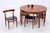 A rare Roundette dining room set by Hans Olsen for Frem Røjle from the Danish Mid-Century period. The round teak table...