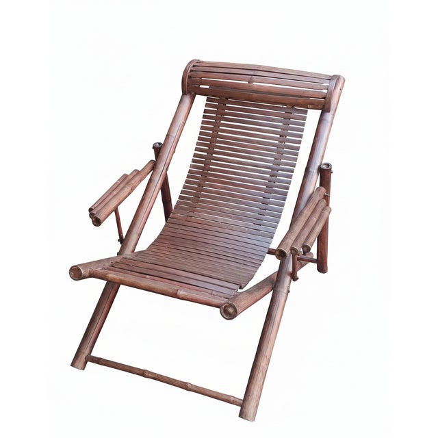 Deckchair made of bamboo and stained wooden slats. Adjustable to two positions. Cushion with convex slats. Fully foldable....