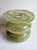 Handblown studio glass vase in a luminous chartreuse green with soft marbled movement throughout the glass. Sculptural...