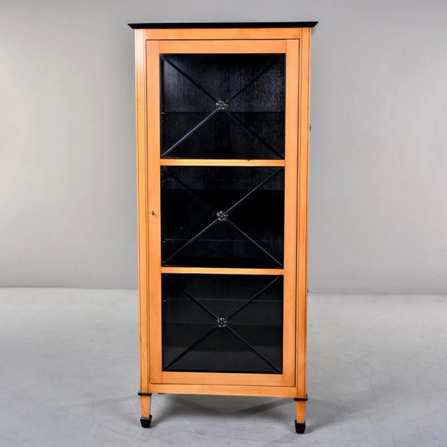 Tall Art Deco inspired cabinet glass front door in light colored wood and ebonised trim. Internal shelves, hand crafted to...