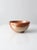 This is a vintage studio pottery bowl. Signed by the artist, the hand-crafted bowl features a dynamic russet brown and...
