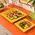 A set of two 1970's bright yellow dishes, with square forms and embossed bamboo motif. Good vintage condition.