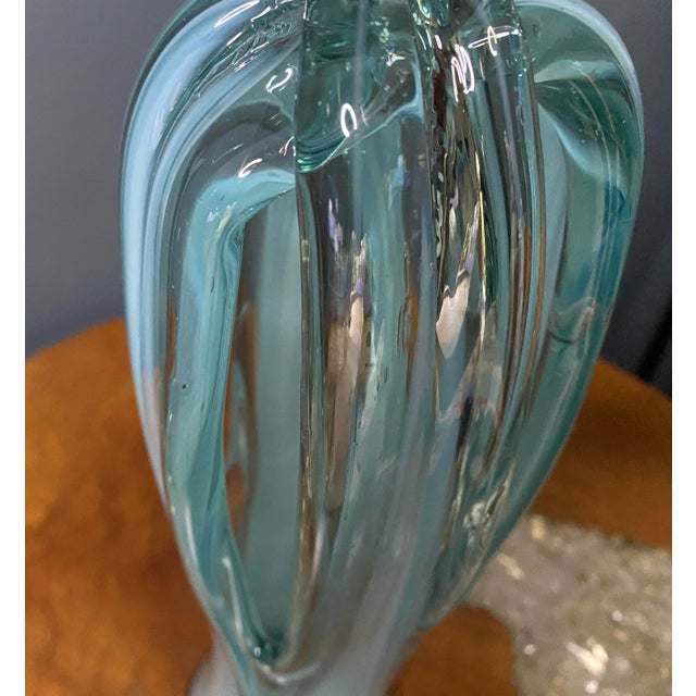 Murano/Venetian Style. The dynamic swirl of opaque white glass cased (layered) under the clear blue is a hallmark...