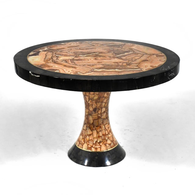 This uncommon table by Guy Muller for Muller of Mexico is crafted of two colors of onyx with inlaid brass details. The...