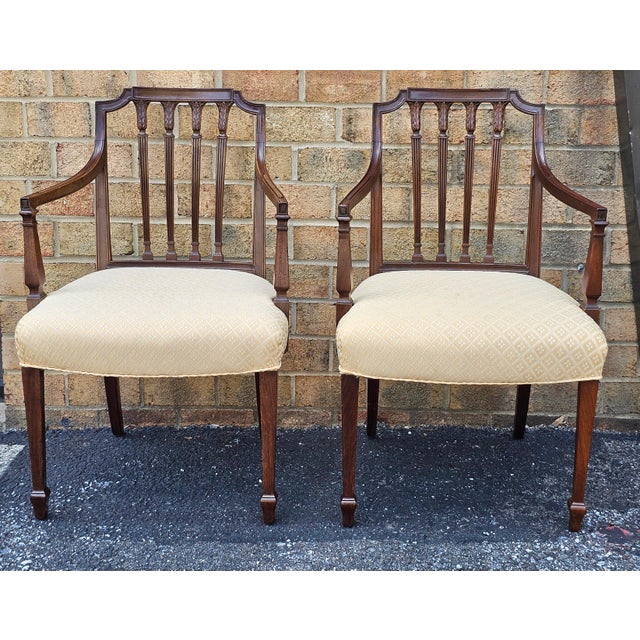 A Fine and Rare Pair of Federal Carved Mahogany Armchairs. Finely carved, stained and Upholstered. Newer golden Yellow...