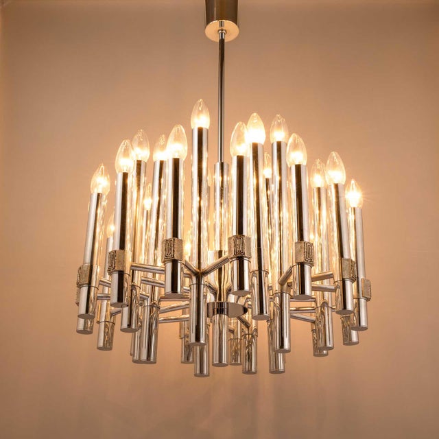This impressive chandelier was designed in the 1960s by gaetano scolari in italy. It is occasionally marketed as a...