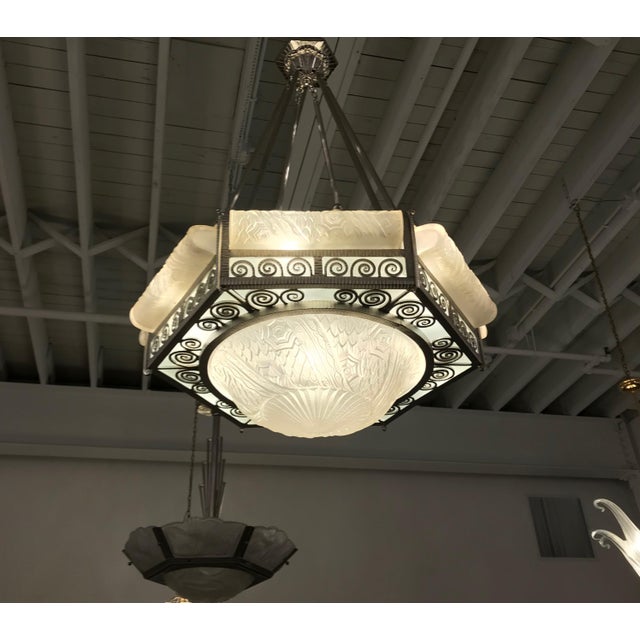 Grand French Art Deco chandelier by the French Artist Charles Schneider. With a hexagon shaped nickel bronze frame,...