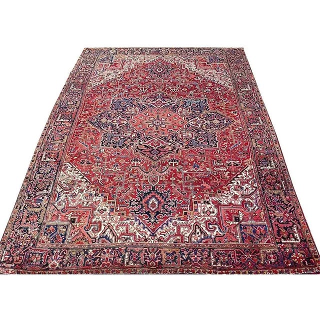 ACTUAL SIZE: 8’3″ x 11’10” PRIMARY COLOR: Rust / Navy AGE: Antique MATERIALS: Wool FOUNDATION: Cotton PRODUCTION:...