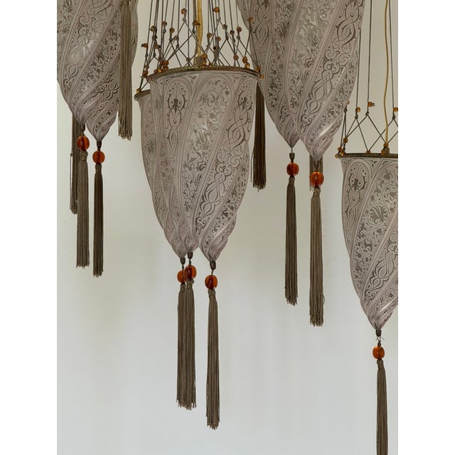 The Iconic Italian Fortuny handmade silk fabric chandelier is rare example with 12 Venetian glass shades (instead of the...
