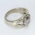This is a 14k White Gold Ring featuring a 0.58ct. G/I1 Round White Diamond Center, accented with White Diamonds. The...