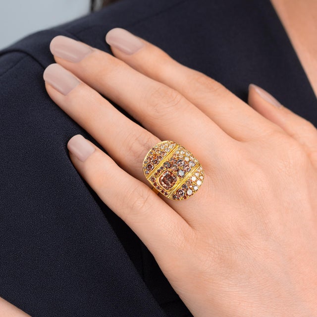 Oval design Natural Fancy Earth tone diamond pave ring. Center stone is .85ct Orangy-Brown VS2 Cushion cut diamond and...