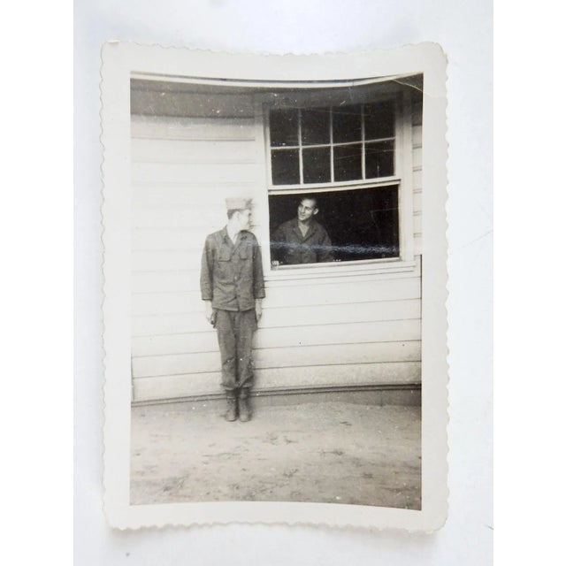 Vintage circa 1940's sepia tone snapshot photograph of two soldiers at window composition. Unsigned. Unframed, light line...