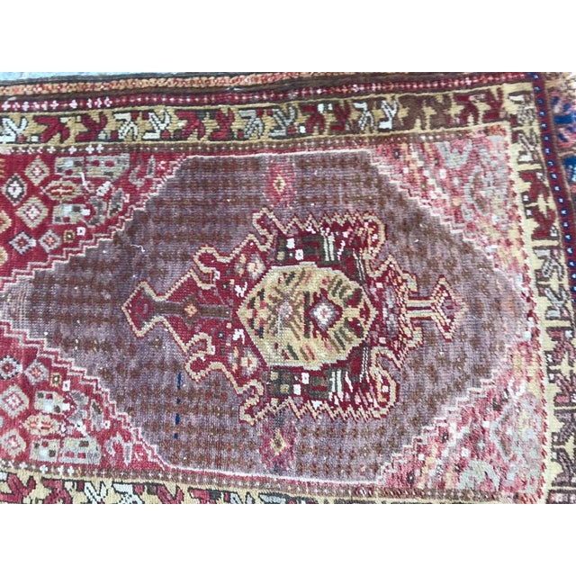 A little early 20th century Turkish rug with a tribal geometric design and nice colors, entirely hand knotted with wool...