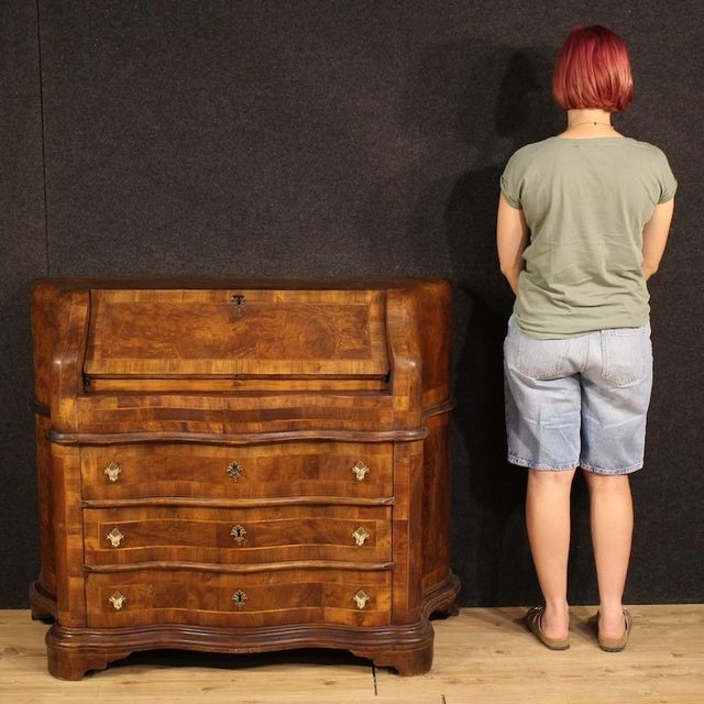 Italian mid-20th-century bureau. A Venetian furniture, curved, veneered and inlaid with walnut, burl, beech, and...