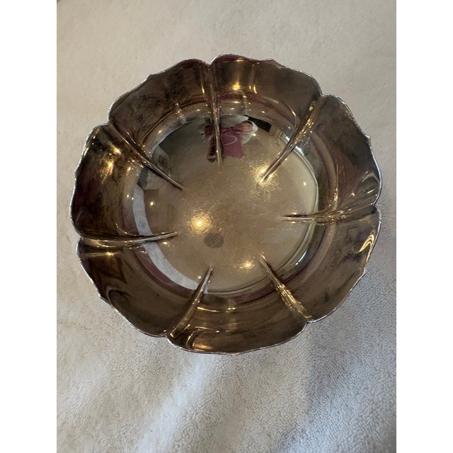 Elegant vintage sterling silver pedestal bowl by Fisher Silversmiths, featuring a gracefully scalloped rim formed by broad...